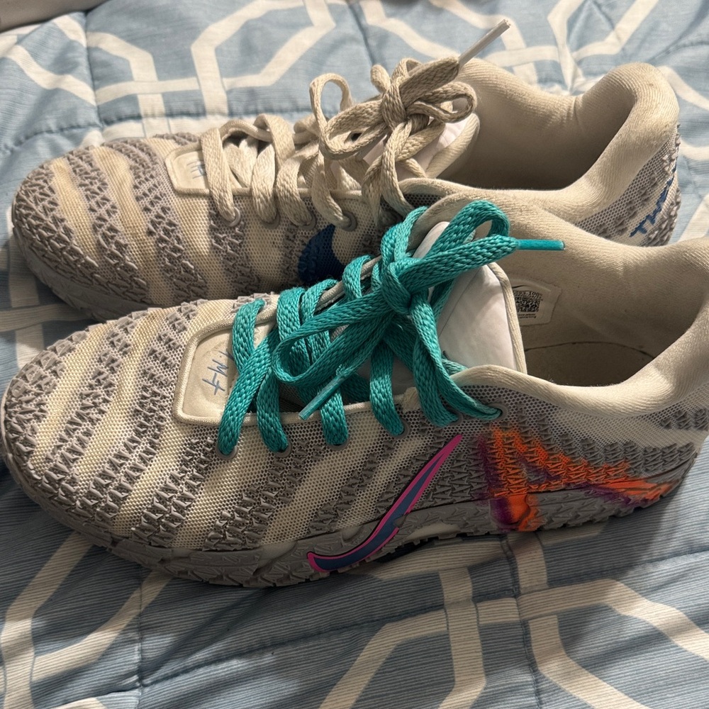 Nike Athletic Shoes with Gray and Teal Accents